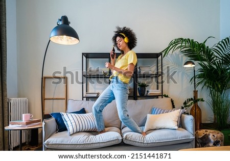 Beautiful latino young woman at home - Pretty south american with curly hair female portrait, lifestyle and domestic life scene
