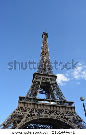 A low angle shot of the Eiffel Tower, Paris, France with blue clear sky
