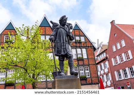 statue of Kiepenkerl im Münster in front of old traditional half timbered houses, Germany Royalty-Free Stock Photo #2151456461