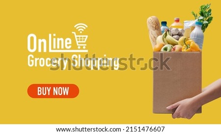 Online grocery shopping and home delivery: hands holding a box full of groceries Royalty-Free Stock Photo #2151476607