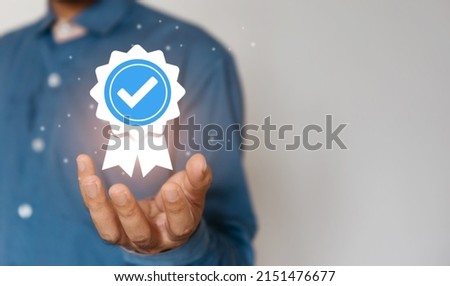 Certification and standardization process, iso certified business, conformity to international standards and quality assurance concept. Person touching certificate icon. Royalty-Free Stock Photo #2151476677