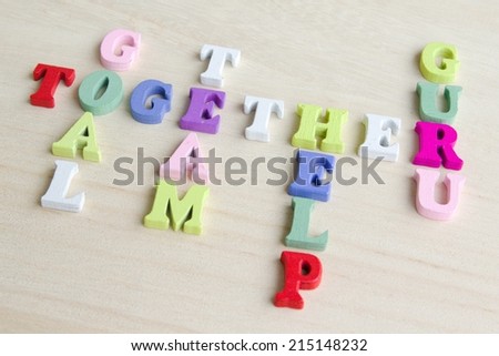 Photo shows a detail of the crossword puzzle funny sign with symbols on a table.