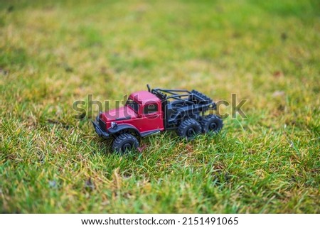 Beautiful view of radio-controlled truck model standing on green grass. Sweden.
