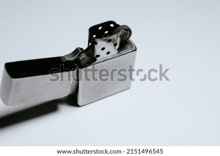 A steel lighter isolated on a white background