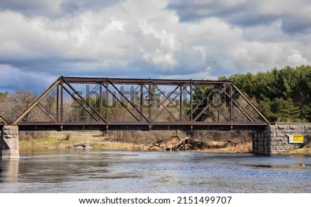 Old iron railway truss bridge built in 1893 crossing the Mississippi river in spring in Galetta, Ontario, Canada Royalty-Free Stock Photo #2151499707