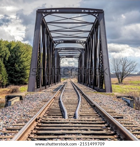 Double span riveted railway truss bridge built in 1893 crossing the Mississippi river in spring in Galetta, Ontario, Canada Royalty-Free Stock Photo #2151499709