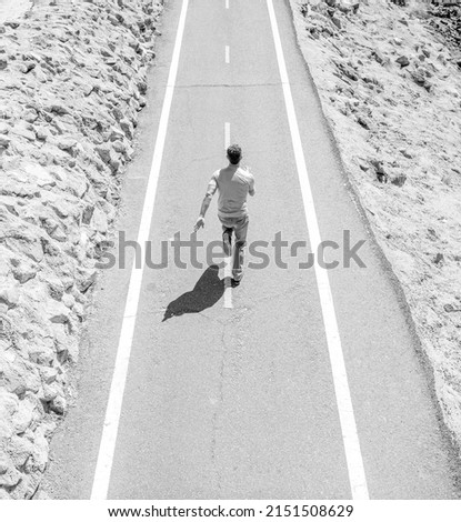 full of energy. guy feel freedom. hurry up. endurance and stamina. everyday run training. back view Royalty-Free Stock Photo #2151508629