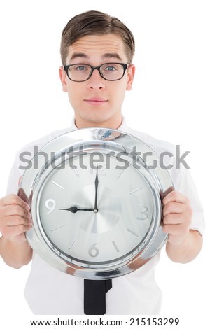 Nerdy businessman showing clock to camera on white background