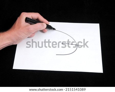A Caucasian Male Hand Drawing on a White Paper