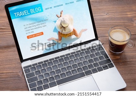Sample travel blog website on the laptop screen Royalty-Free Stock Photo #2151554417