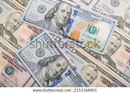 Close-up of one hundred and fifty dollar bills on the table. Horizontal photo