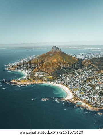 An aerial shot of the coast of Cape Town, South Africa and Signal Hill