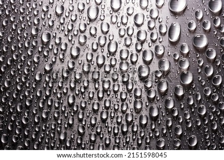 Gray flat metallic surface with drops of water. Abstract background of metal texture