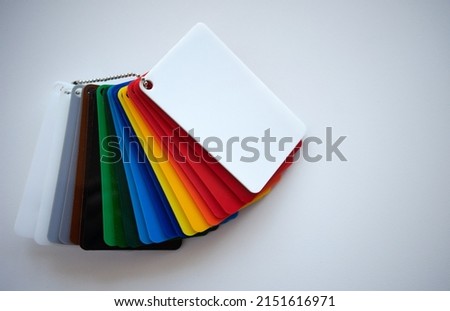 Multicolored layout of plastic samples on white isolate.Selection of the right color in the store.Sale of plastic. Royalty-Free Stock Photo #2151616971