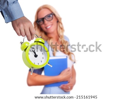 Alarm clock with young student in the background as back to school concept