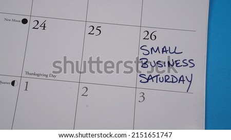 Small Business Saturday written on a calendar on November 26, 2022.                                Royalty-Free Stock Photo #2151651747
