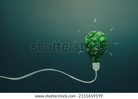 energy saving light bulb made with green leaves. Minimal nature concept. Think green. Ecology concept. Environmentally friendly planet. Copy space Royalty-Free Stock Photo #2151659199