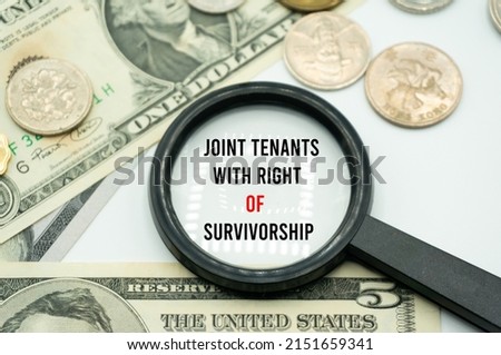 Joint Tenants With Right of Survivorship.Magnifying glass showing the words.Background of banknotes and coins.basic concepts of finance.Business theme.Financial terms.