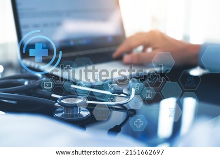 Medical technology network concept. Medicine doctor working on laptop computer with icon medical network connection with modern virtual screen interface, telemedicine, health technology background Royalty-Free Stock Photo #2151662697