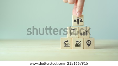 Feasibility study, business investment concept. Assessing the practicality of a proposed plan or project for launching a new business or adopting a new product line. Stacking wooden cube feasibility. Royalty-Free Stock Photo #2151667915