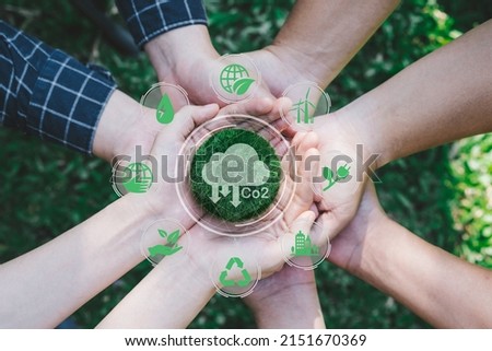 Hands adult Teamwork harmony Holding earth on hands. Sustainable development and business based on renewable energy. Reduce CO2 emission concept. Royalty-Free Stock Photo #2151670369