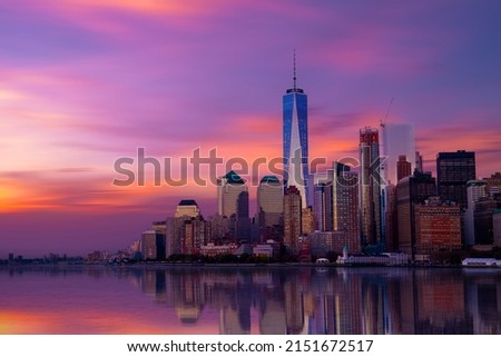 New York City Manhattan downtown skyline at dusk with skyscrapers over Hudson River,
