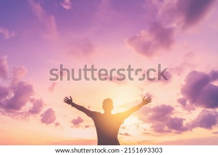 Copy space of man rise hand up on sunset sky at beach and island background. Freedom and travel adventure concept. Vintage tone filter effect color style. Royalty-Free Stock Photo #2151693303