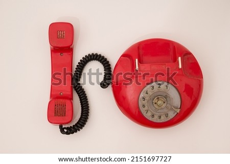 A red retro telephone isolated on white, Call for help