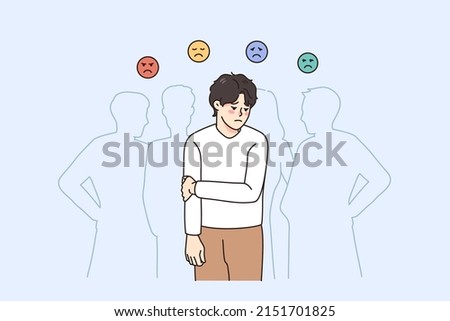 Sad guy feel lonely and uncomfortable in society. Unhappy young man suffer from solitude and loneliness in crowd, have various emotions. Frustration and depression. Vector illustration.  Royalty-Free Stock Photo #2151701825