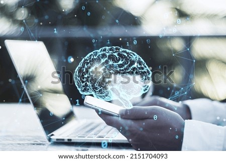 Close up of businessman hands using laptop and smartphone with creative polygonal brain hologram on blurry background. Neurology and anatomy concept. Double exposure