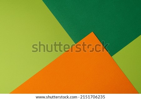 Horizontal of colorful geometric shaped overlapped orange and green cardboard layers of paper on background, copy space, overhead. Rectangular design concept Royalty-Free Stock Photo #2151706235