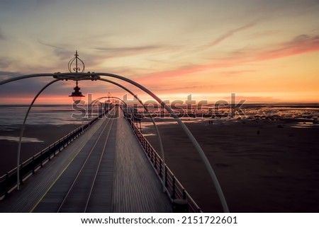 Southport pier panoramic view at sunset with scenic landscape and no people. Romantic travel destination United Kingdom Royalty-Free Stock Photo #2151722601