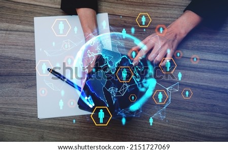 Businesswoman finger touch tablet, top view. Blank sheet of paper and pen on table. Hud hologram with earth globe, worldwide connection. Concept of recruitment Royalty-Free Stock Photo #2151727069