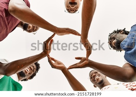 Group of young african american artist man smiling happy doing circle with hands together at art studio.