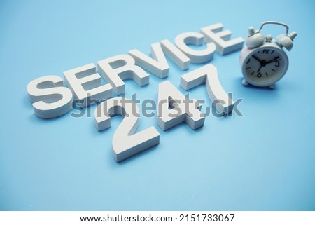24 Hrs 7 Day Service alphabet letters on blue background