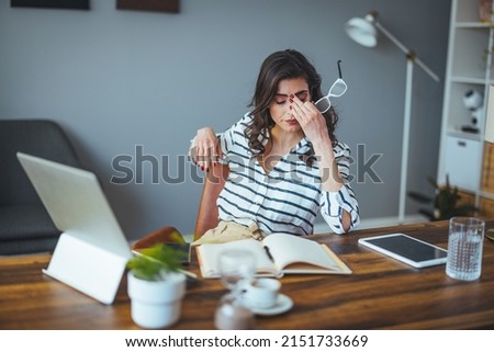 Thoughtful anxious business woman looking away thinking solving problem at work, worried serious young woman concerned make difficult decision lost in thought reflecting sit with laptop Royalty-Free Stock Photo #2151733669