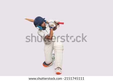 Portrait of boy hitting a shot During a Cricket Game Royalty-Free Stock Photo #2151745111