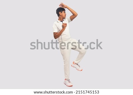 A boy Delivering a spin ball During a Cricket Game