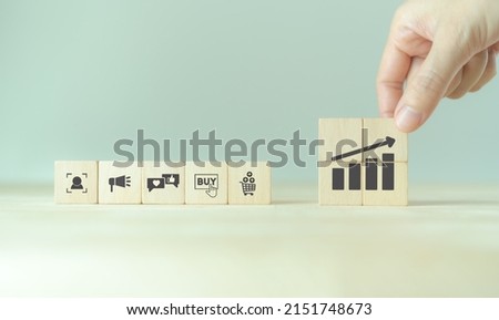 Growth of sales, marketing strategies concept. Data analytics for achieving business growth target. Increase sales in online store, e-commerce. Placing wooden cubes with sales growth. Postive progress Royalty-Free Stock Photo #2151748673