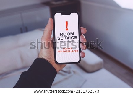 Room service not available message on mobile smartphone, selective focus Royalty-Free Stock Photo #2151752573