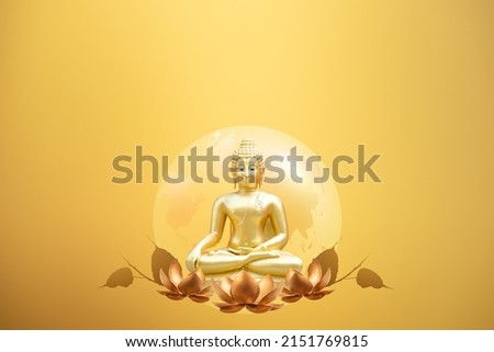 Buddha statue and lotus flowers on gold background.