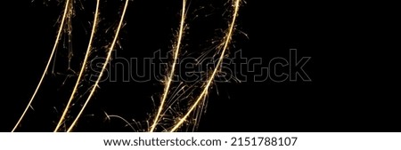 sparks in the dark, lines of glowing sparks