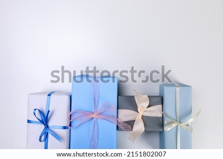  tulips  and gift box on white background. Stylish soft image of spring flowers. Happy womens day. Happy Mothers day