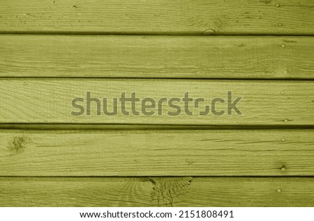 Old grungy wooden planks background in yellow color. Abstract background and texture for design.                      