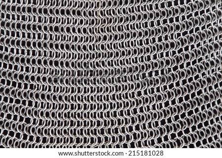 macro texture seamless chain mail made of metal Royalty-Free Stock Photo #215181028
