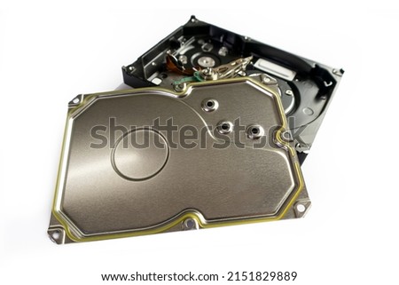On a white background, image of stainless steel memory electronic device parts.