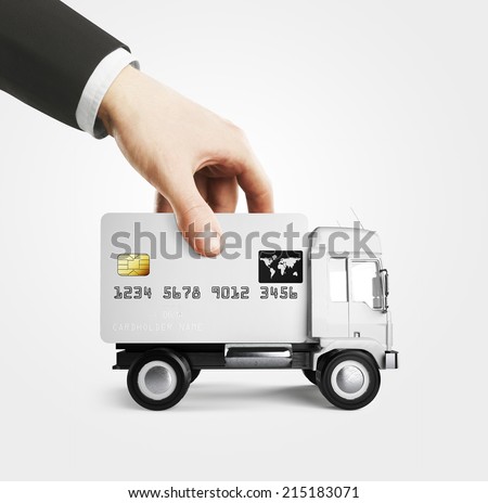 Businessman holding truck credit card form concept