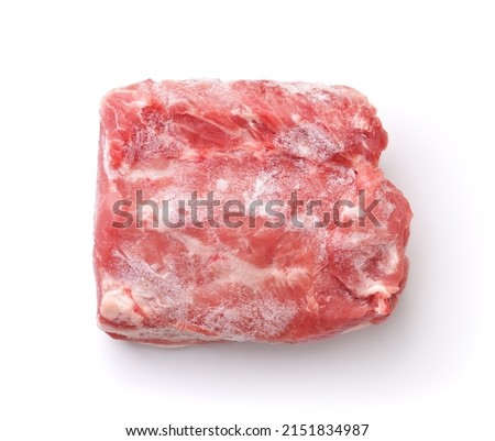 Top view of raw frozen boneless pork meat piece isolated on white