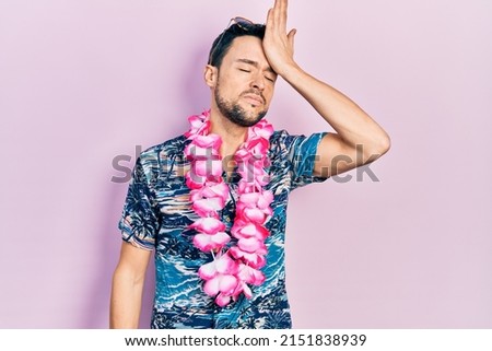Young hispanic man wearing summer style surprised with hand on head for mistake, remember error. forgot, bad memory concept.  Royalty-Free Stock Photo #2151838939