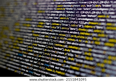 Colorful code background. compressed javascript code on computer screen. Software developer coding screen